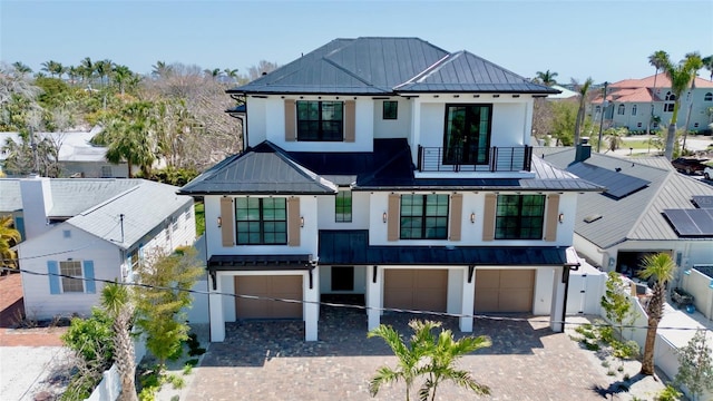 723 S Blvd Of The Presidents, Sarasota, FL 34236 - view of front of house featuring a standing seam roof, a balcony, and metal roof