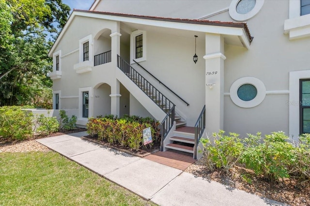 7639 Fairway Woods Dr Unit 605, Sarasota, FL 34238 - property entrance with stucco siding