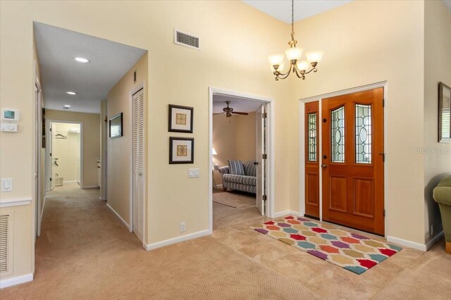 7639 Fairway Woods Dr Unit 605, Sarasota, FL 34238 - foyer with light colored carpet, baseboards, a chandelier, and visible vents