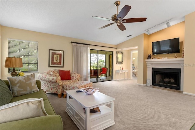 7639 Fairway Woods Dr Unit 605, Sarasota, FL 34238 - living room featuring a fireplace with flush hearth, carpet, track lighting, visible vents, and ceiling fan
