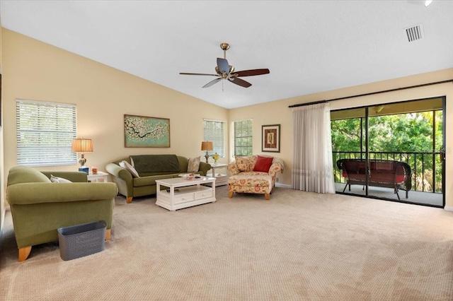 7639 Fairway Woods Dr Unit 605, Sarasota, FL 34238 - living area with lofted ceiling, visible vents, carpet flooring, and a healthy amount of sunlight