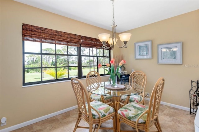 7639 Fairway Woods Dr Unit 605, Sarasota, FL 34238 - dining area with plenty of natural light, baseboards, and a notable chandelier