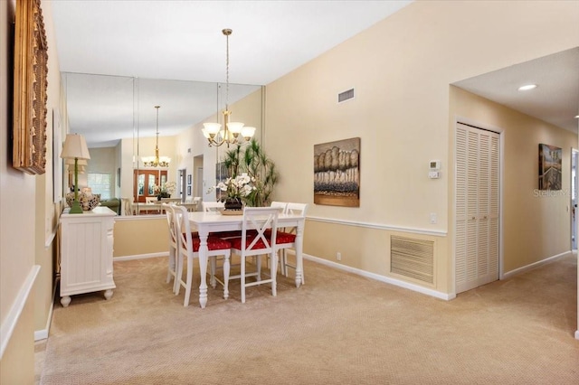 7639 Fairway Woods Dr Unit 605, Sarasota, FL 34238 - dining space with light colored carpet, an inviting chandelier, visible vents, and baseboards