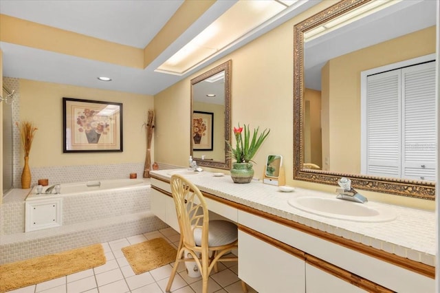 7639 Fairway Woods Dr Unit 605, Sarasota, FL 34238 - full bathroom with double vanity, a garden tub, tile patterned flooring, and a sink