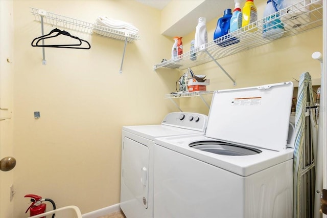 7639 Fairway Woods Dr Unit 605, Sarasota, FL 34238 - laundry room with baseboards, washer and dryer, and laundry area