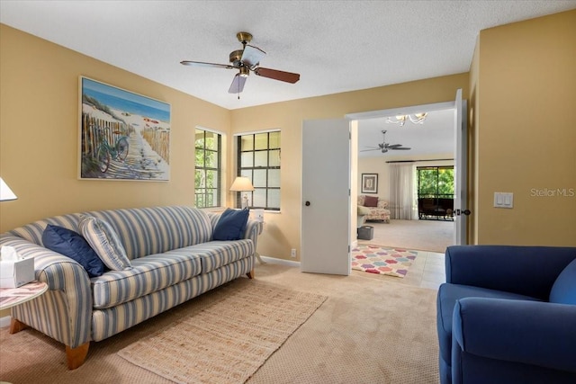 7639 Fairway Woods Dr Unit 605, Sarasota, FL 34238 - living area featuring ceiling fan with notable chandelier and carpet