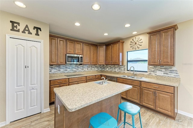 2084 La Palma Ave, Port Charlotte, FL 33953 - kitchen featuring stainless steel appliances, a sink, light countertops, decorative backsplash, and recessed lighting