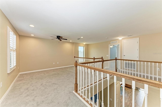 2084 La Palma Ave, Port Charlotte, FL 33953 - hallway featuring an upstairs landing, plenty of natural light, baseboards, and recessed lighting