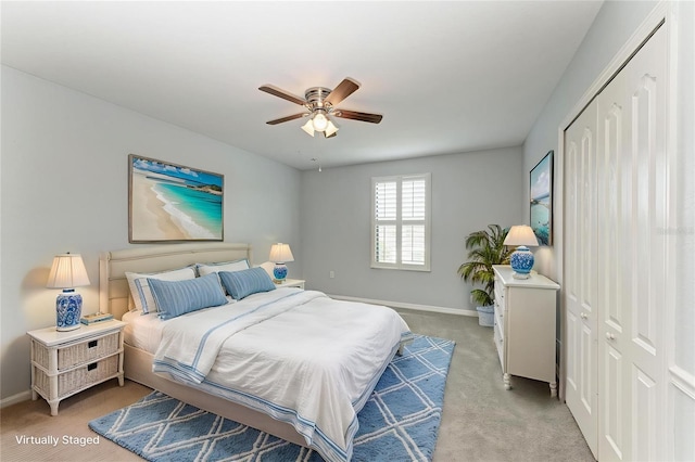 2084 La Palma Ave, Port Charlotte, FL 33953 - bedroom with baseboards, light carpet, a ceiling fan, and a closet
