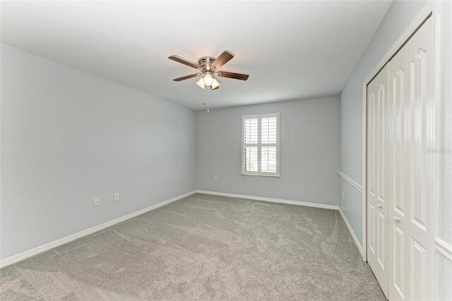 2084 La Palma Ave, Port Charlotte, FL 33953 - unfurnished bedroom featuring carpet flooring, a closet, baseboards, and a ceiling fan