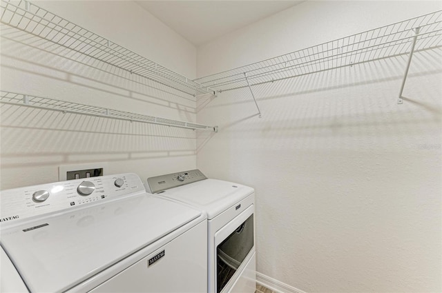 2084 La Palma Ave, Port Charlotte, FL 33953 - laundry area featuring washer and clothes dryer and baseboards