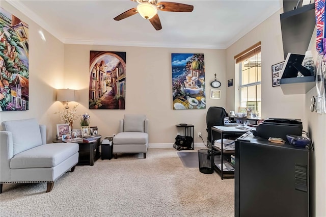 office space with crown molding, baseboards, carpet, and a ceiling fan