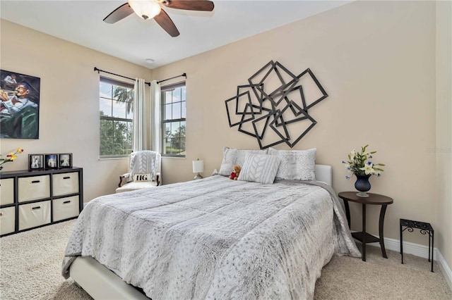 bedroom with baseboards, a ceiling fan, and carpet flooring