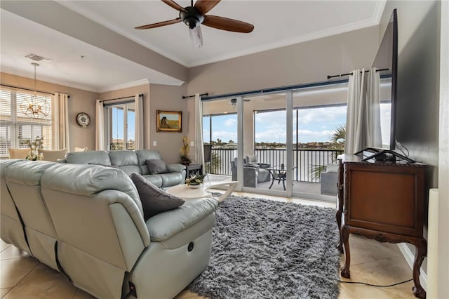living area with visible vents, crown molding, ceiling fan with notable chandelier, and light tile patterned floors