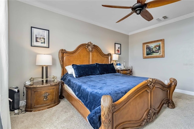 bedroom featuring a ceiling fan, visible vents, crown molding, baseboards, and carpet flooring