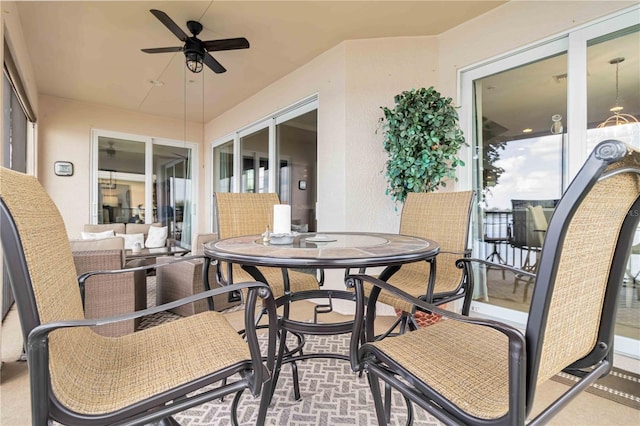 exterior space featuring ceiling fan, an outdoor hangout area, and outdoor dining space
