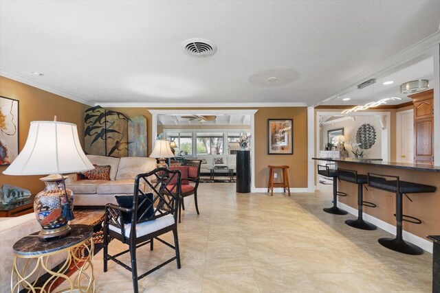 10432 Sandpiper Rd W, Bradenton, FL 34209 - living area featuring visible vents, crown molding, a ceiling fan, and baseboards
