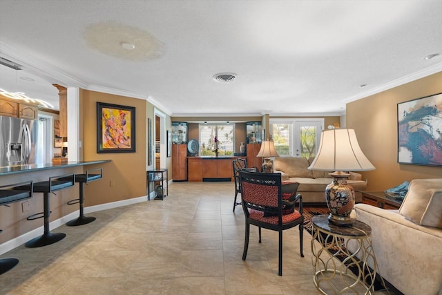 10432 Sandpiper Rd W, Bradenton, FL 34209 - living area featuring visible vents, ornamental molding, and baseboards