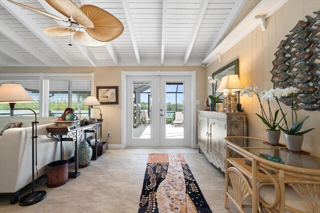 10432 Sandpiper Rd W, Bradenton, FL 34209 - interior space featuring vaulted ceiling with beams, a ceiling fan, wooden walls, and french doors