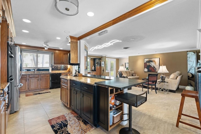 10432 Sandpiper Rd W, Bradenton, FL 34209 - kitchen with crown molding, recessed lighting, a kitchen breakfast bar, and open floor plan