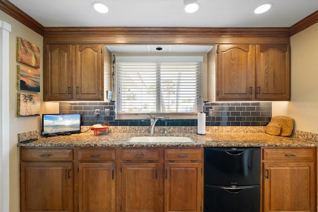 10432 Sandpiper Rd W, Bradenton, FL 34209 - kitchen featuring light stone countertops, backsplash, black fridge, and a sink