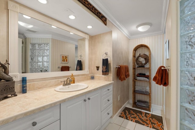 10432 Sandpiper Rd W, Bradenton, FL 34209 - bathroom featuring vanity, crown molding, tile patterned flooring, and baseboards