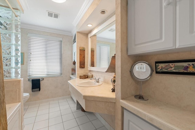 10432 Sandpiper Rd W, Bradenton, FL 34209 - full bath with tile patterned flooring, ornamental molding, toilet, vanity, and visible vents