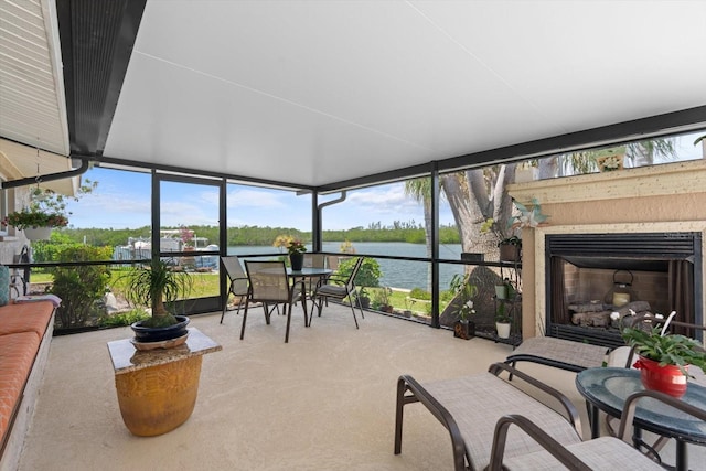 10432 Sandpiper Rd W, Bradenton, FL 34209 - sunroom featuring floor to ceiling windows, a water view, and carpet floors
