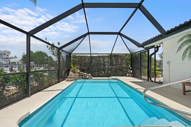 10432 Sandpiper Rd W, Bradenton, FL 34209 - pool featuring glass enclosure and a patio area
