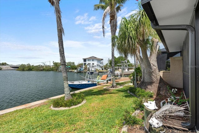 10432 Sandpiper Rd W, Bradenton, FL 34209 - view of dock with a lawn and a water view