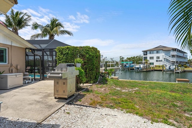 10432 Sandpiper Rd W, Bradenton, FL 34209 - view of yard featuring a patio area, glass enclosure, a water view, and an outdoor pool