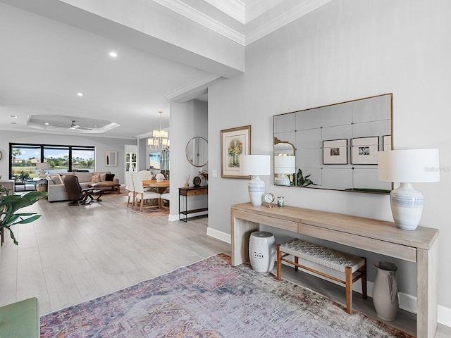 15037 Montello Way, Lakewood Ranch, FL 34211 - interior space featuring recessed lighting, crown molding, baseboards, wood finished floors, and ceiling fan with notable chandelier