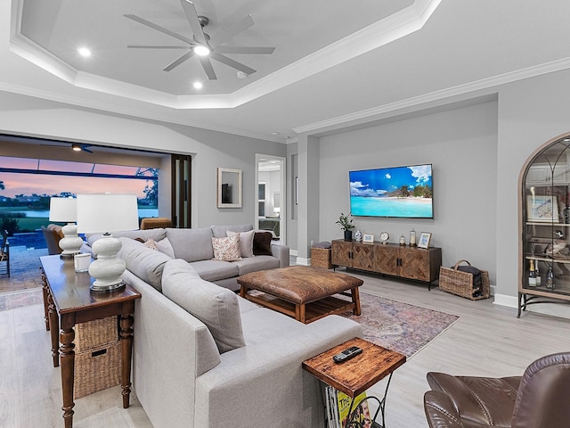 15037 Montello Way, Lakewood Ranch, FL 34211 - living room featuring ceiling fan, a tray ceiling, light wood-type flooring, recessed lighting, and ornamental molding