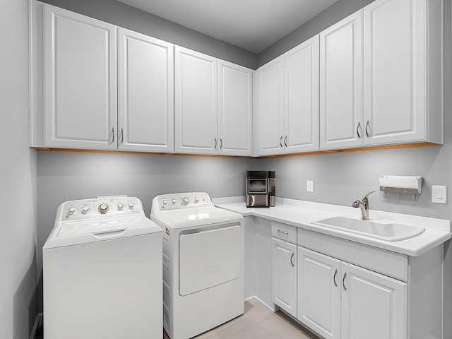 15037 Montello Way, Lakewood Ranch, FL 34211 - washroom featuring light tile patterned floors, separate washer and dryer, cabinet space, and a sink