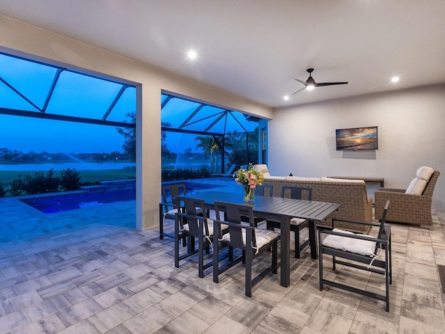 15037 Montello Way, Lakewood Ranch, FL 34211 - interior space with a lanai, outdoor dining space, a ceiling fan, and an outdoor pool