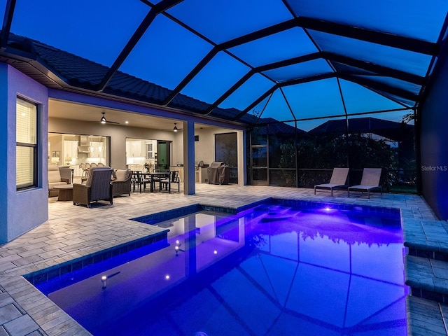 15037 Montello Way, Lakewood Ranch, FL 34211 - pool at twilight featuring a patio, an outdoor pool, area for grilling, outdoor dining space, and ceiling fan