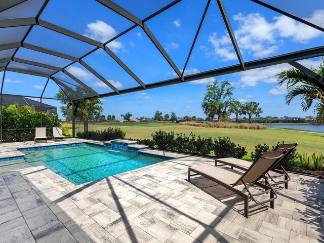 15037 Montello Way, Lakewood Ranch, FL 34211 - view of swimming pool featuring a lawn, a patio, a water view, and a lanai