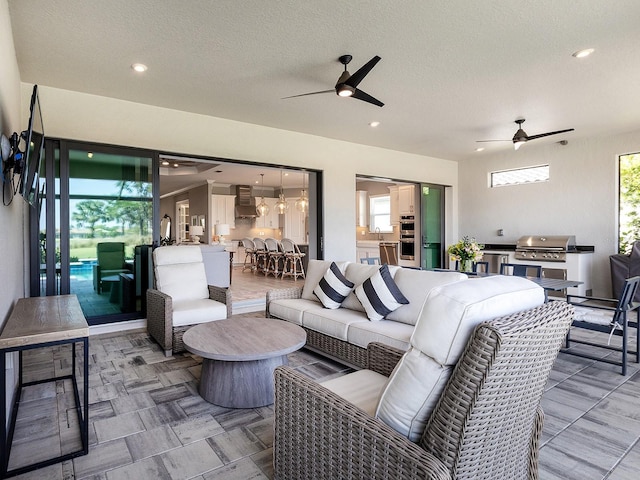 15037 Montello Way, Lakewood Ranch, FL 34211 - view of patio / terrace with an outdoor hangout area, an outdoor kitchen, ceiling fan, and a grill