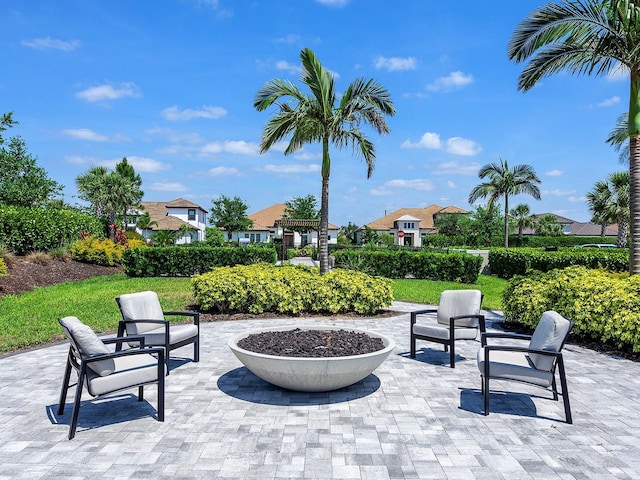 15037 Montello Way, Lakewood Ranch, FL 34211 - view of patio / terrace with a fire pit and a residential view