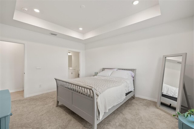 9725 Last Light Gln, Parrish, FL 34219 - carpeted bedroom with a tray ceiling, recessed lighting, and baseboards