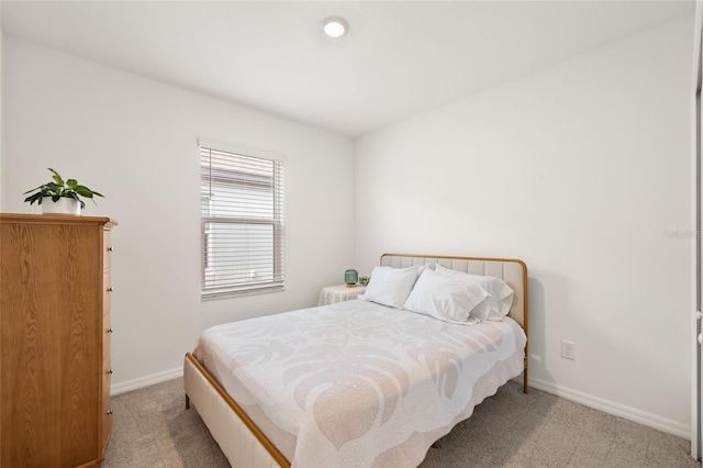 9725 Last Light Gln, Parrish, FL 34219 - bedroom featuring light carpet and baseboards
