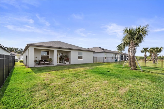 9725 Last Light Gln, Parrish, FL 34219 - back of property featuring stucco siding and a shingled roof