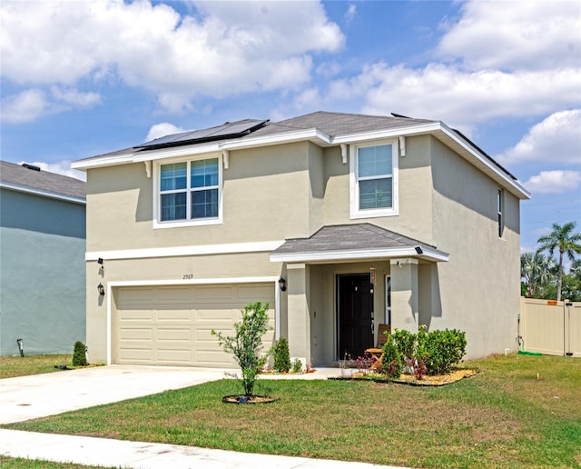 2969 Great Abaco Way, Bradenton, FL 34208 - traditional-style home with an attached garage, solar panels, concrete driveway, and stucco siding