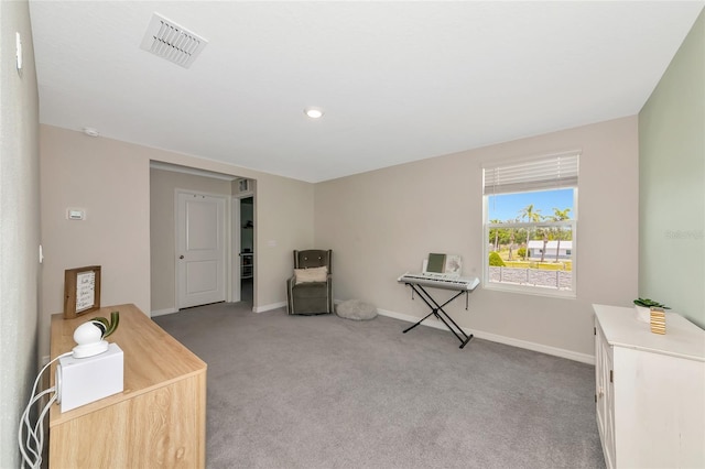 2969 Great Abaco Way, Bradenton, FL 34208 - sitting room with light carpet and baseboards