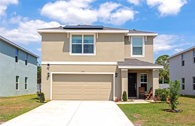 2969 Great Abaco Way, Bradenton, FL 34208 - traditional-style home featuring a front yard, driveway, solar panels, and stucco siding