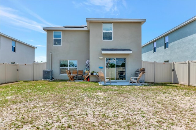 2969 Great Abaco Way, Bradenton, FL 34208 - rear view of property with central air condition unit, stucco siding, a gate, and a fenced backyard