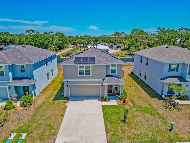 2969 Great Abaco Way, Bradenton, FL 34208 - traditional home with stucco siding, a garage, driveway, solar panels, and a front lawn