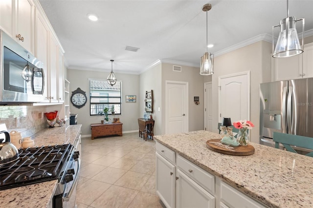 14309 Carolina Sky Pl, Lakewood Ranch, FL 34211 - kitchen with visible vents, white cabinetry, and stainless steel appliances