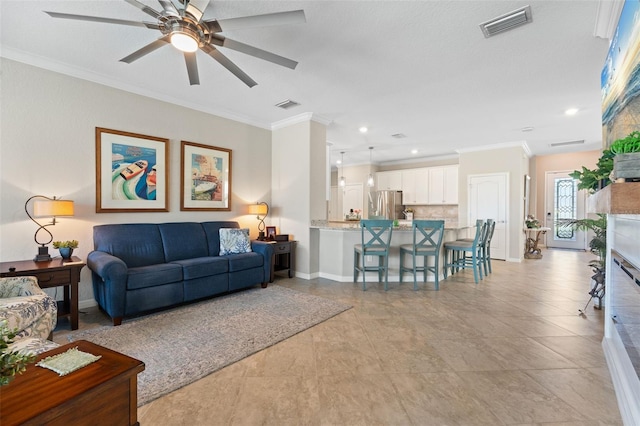 14309 Carolina Sky Pl, Lakewood Ranch, FL 34211 - living area featuring ornamental molding, a ceiling fan, visible vents, and baseboards