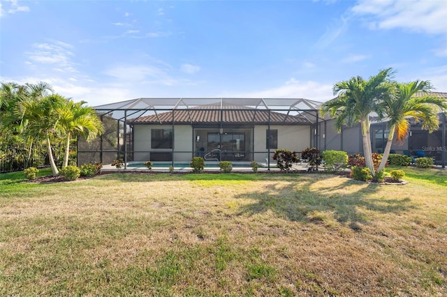 14309 Carolina Sky Pl, Lakewood Ranch, FL 34211 - rear view of property featuring glass enclosure, a yard, and an outdoor pool